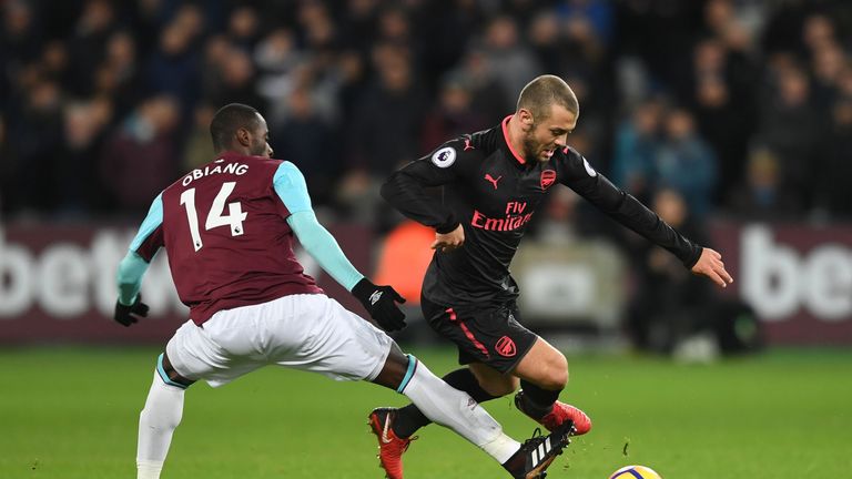 Jack Wilshere gets away from Pedro Obiang