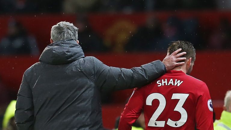 Luke Shaw is congratulated by Jose Mourinho after being substituted during the Premier League against Bournemouth