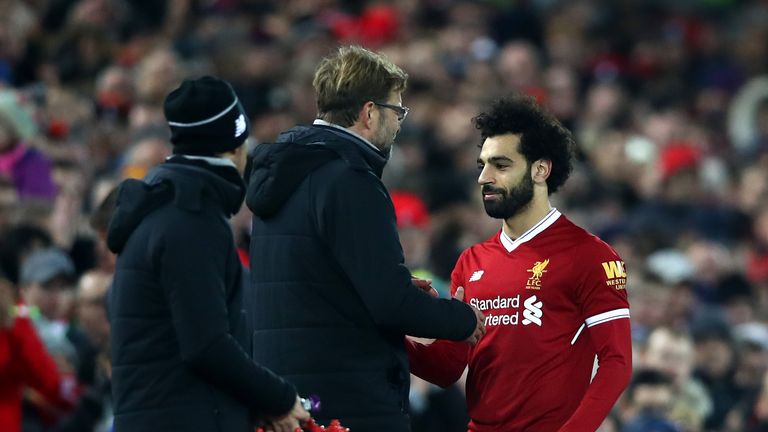 Jurgen Klopp congratulates goalscorer Mohamed Salah as he leaves the pitch during the Premier League match against Leicester City