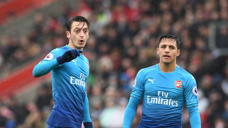 Mesut Ozil and Alexis Sanchez stand over the ball during a Premier League match against Southampton at St Mary's on December 10, 2017