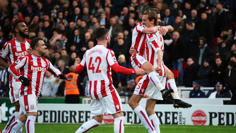 Joe Allen celebrates with Peter Crouch after scoring his sides first goal