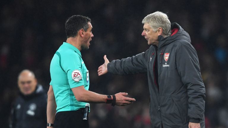 LONDON, ENGLAND - DECEMBER 02: Arsene Wenger, Manager of Arsenal argues with referee Andre Marriner after during the Premier League match between Arsenal a