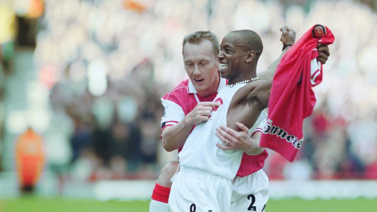 Ian Wright celebrates with Lee Dixon after breaking Cliff Bastin's Arsenal goalscoring record of 178 goals with a hat-trick against Bolton