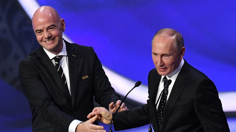 FIFA president Gianni Infantino (L) smiles with Russian President Vladimir Putin while delivering speeches during the 2018 FIFA World Cup football tourname