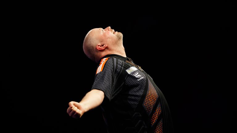 Raymond van Barneveld celebrates his defeating Richard North during day six of the William Hill World Darts Championship