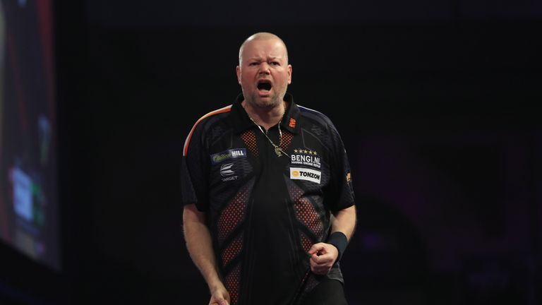 A relaxed and confident Raymond van Barneveld cruised into round two