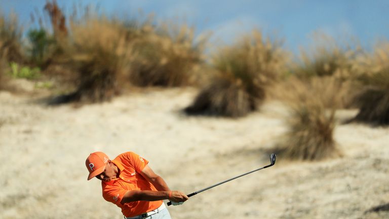 NASSAU, BAHAMAS - DECEMBER 03:  Rickie Fowler of the United States plays a shot on the fourth hole during the final round of the Hero World Challenge at Al