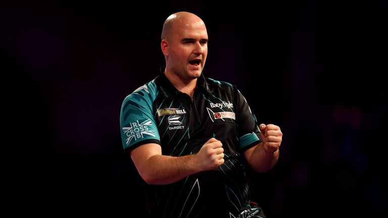 Rob Cross celebrates during his victory over Dimitri Van Den Bergh