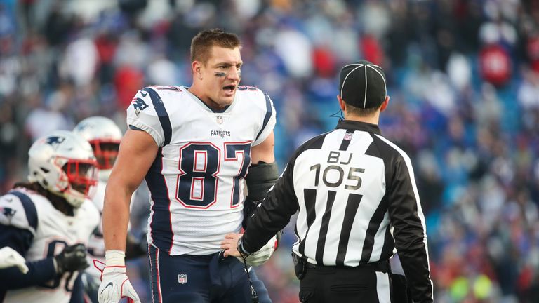 ORCHARD PARK, NY - DECEMBER 3:  Rob Gronkowski #87 of the New England Patriots talks with back judge Dino Paganelli #105 during the fourth quarter against 