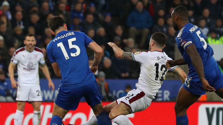 LEICESTER, ENGLAND - DECEMBER 02:  Robbie Brady of Burnley is challenged by Harry Maguire of Leicester City during the Premier League match between Leicest