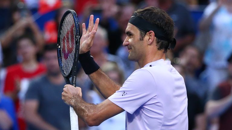 Roger Federer celebrates after easing to victory in his Hopman Cup opener