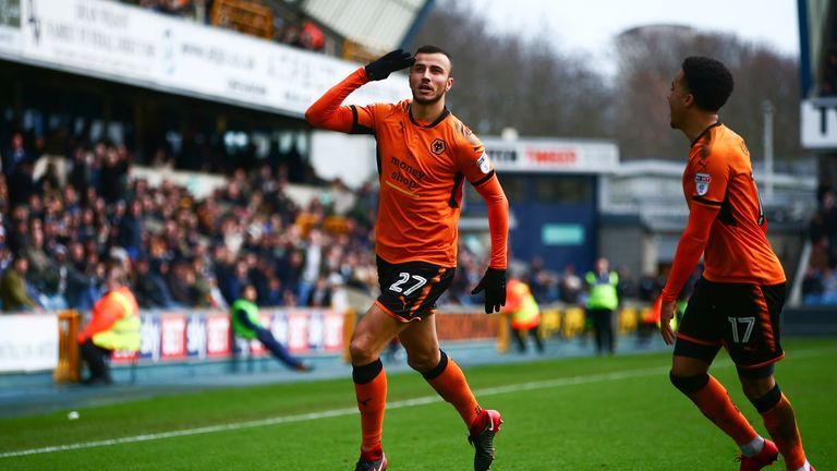 Romain Saiss celebrates after making it 2-1 to Wolves at The Den