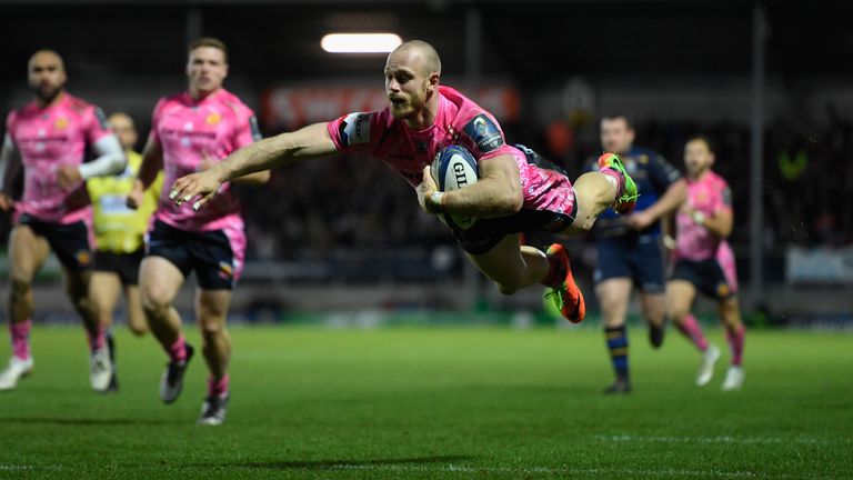 EXETER, ENGLAND - DECEMBER 10:  Chiefs wing Olly Woodburn dives over to score during the European Rugby Champions Cup match between Exeter Chiefs and Leins