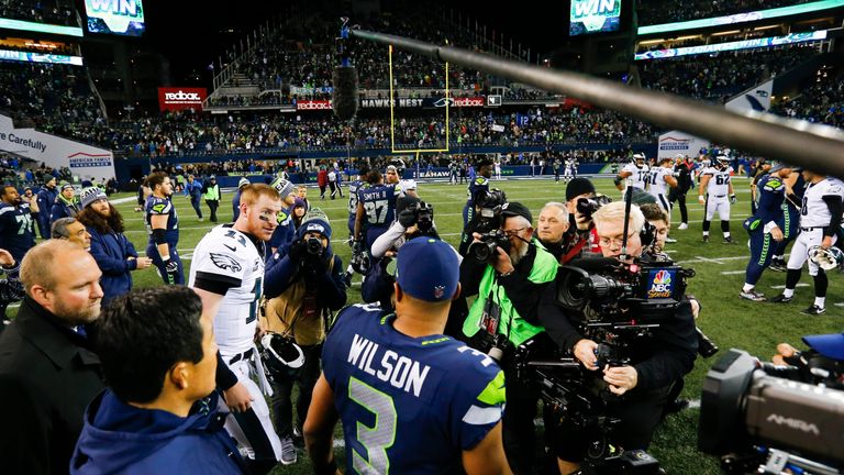 SEATTLE, WA - DECEMBER 03:  Quarterback Carson Wentz #11 of the Philadelphia Eagles and quarterback Russell Wilson #3 of the Seattle Seahawks greet each ot