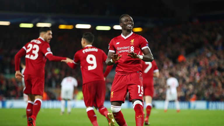 LIVERPOOL, ENGLAND - DECEMBER 06:  Sadio Mane of Liverpool celebrates scoring the 4th Liverpool goal with team mates during the UEFA Champions League group