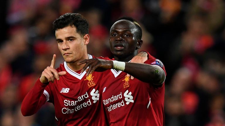 Liverpool's Senegalese midfielder Sadio Mane (R) celebrates scoring their sixth goal with Liverpool's Brazilian midfielder Philippe Coutinho (L) during the