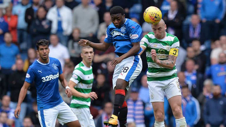 Scott Brown is challenged by Rangers' Aaron Nemane during Celtic's 2-0 win at Ibrox