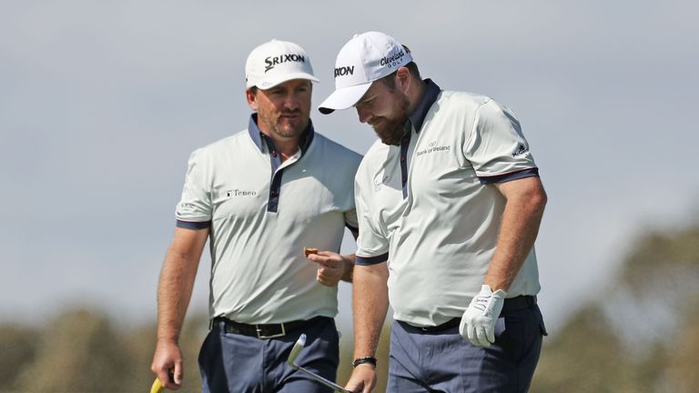 MELBOURNE, AUSTRALIA - NOVEMBER 24:  Shane Lowry and Graeme McDowell of Ireland talk during day one of the World Cup of Golf at Kingston Heath Golf Club on