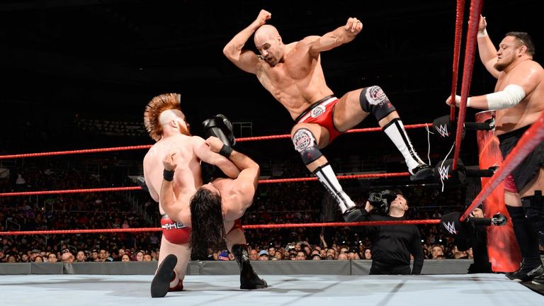Sheamus and Cesaro hit Seth Rollins with a double-team move