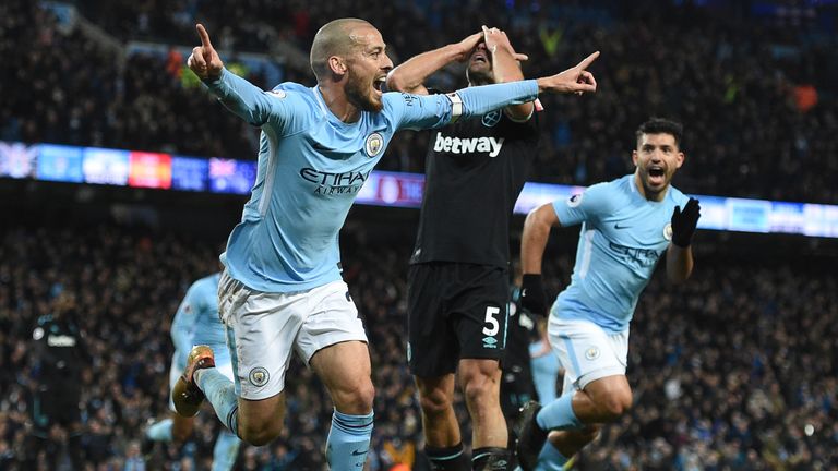 West Ham United's Argentinian defender Pablo Zabaleta (C) reacts as Manchester City's Spanish midfielder David Silva (L) celebrates scoring their second go