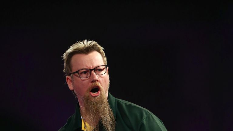 Simon Whitlock celebrates during his match against Darren Webster on day eleven of the William Hill World Darts Championship