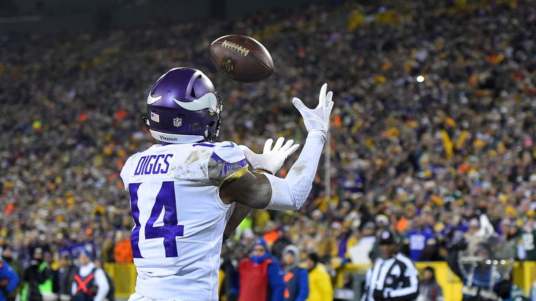 GREEN BAY, WI - DECEMBER 23:  Stefon Diggs #14 of the Minnesota Vikings catches a pass for a touchdown during the first quarter against the Green Bay Packe