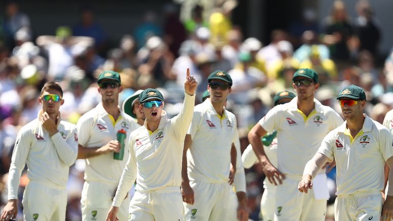 Steve Smith of Australia signals to Mark Stoneman of England after he began to walk back to the middle after being dismissed