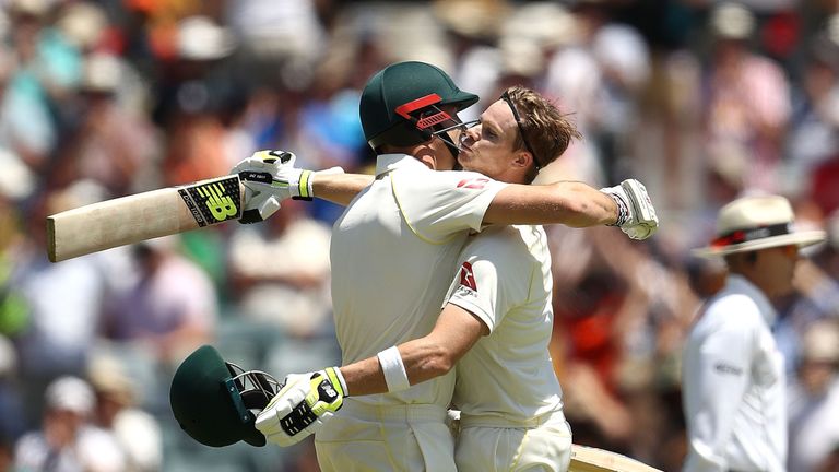 Steve Smith of Australia celebrates with Shaun Marsh of Australia after reaching his century during day three