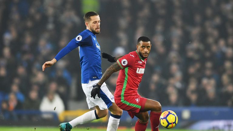 LIVERPOOL, ENGLAND - DECEMBER 18:  Luciano Narsingh of Swansea City holds off Gylfi Sigurdsson of Everton during the Premier League match between Everton a