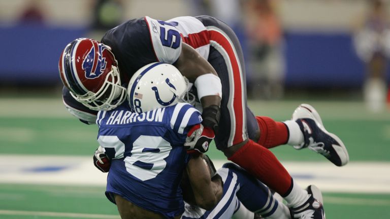 INDIANAPOLIS - AUGUST 28:  Takeo Spikes of the Buffalo Bills tackles Marvin Harrison of the Indianapolis Colts during the preseason NFL game on August 28, 
