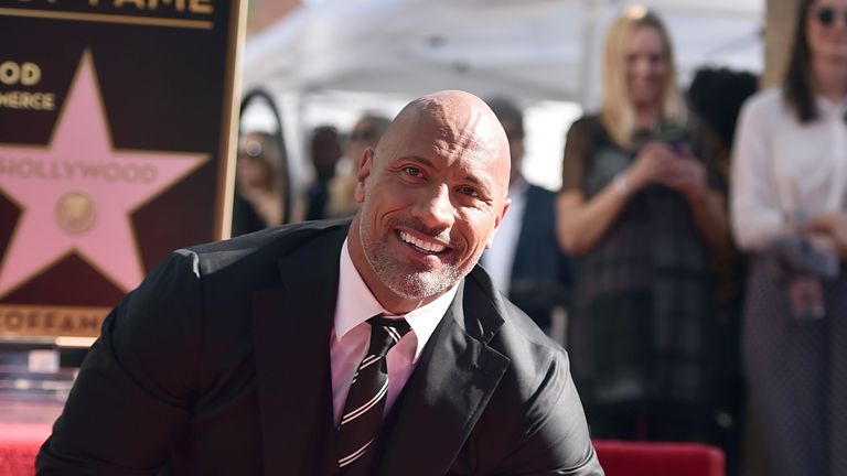 The Rock - real name Dwayne Johnson - attends a ceremony honouring him with the 2,624th star on the Hollywood Walk of Fame