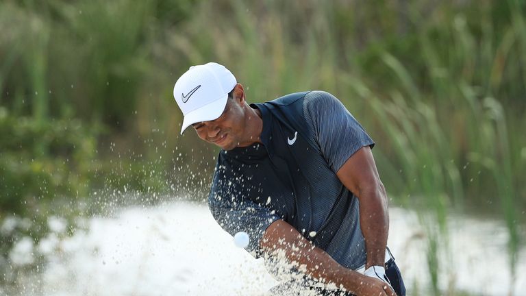 NASSAU, BAHAMAS - DECEMBER 02:  Tiger Woods of the United States plays a shot from a bunker on the fifth hole during the third round of the Hero World Chal