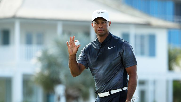NASSAU, BAHAMAS - DECEMBER 02:  Tiger Woods of the United States reacts to his par on the fifth green during the third round of the Hero World Challenge at