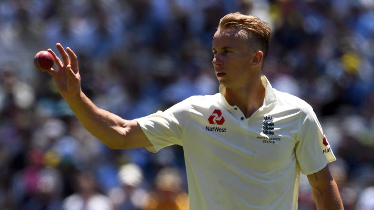 England bowler Tom Curran receives the ball as he bowls against Australia on the first day of the fourth Ashes cricket Test match at the MCG in Melbourne o