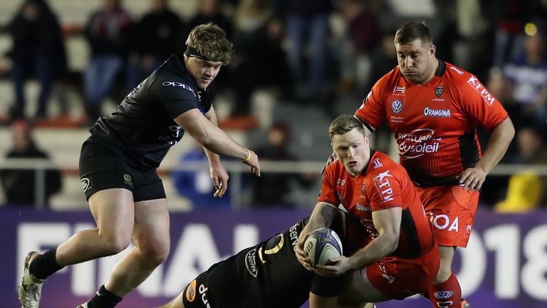 TOULON, FRANCE - DECEMBER 09:  Chris Ashton of Toulon is tackled by Tom Dunn and Nick Auterac (L) during the European Rugby Champions Cup match between RC 