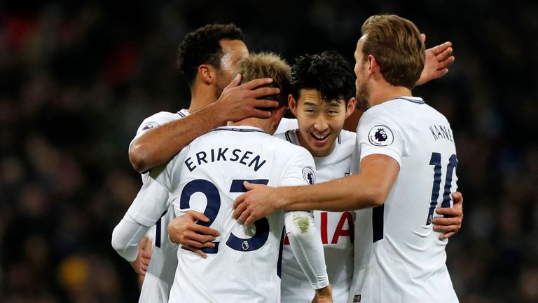 Tottenham Hotspur's Danish midfielder Christian Eriksen (2nd L) celebrates with teammates after scoring their fifth goal during the English Premier League 