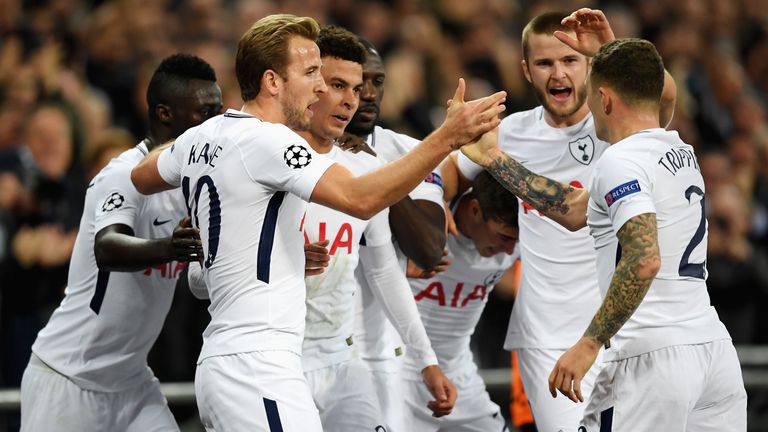 Dele Alli of Tottenham Hotspur celebrates scoring his side's first goal with team mates during the Champions League