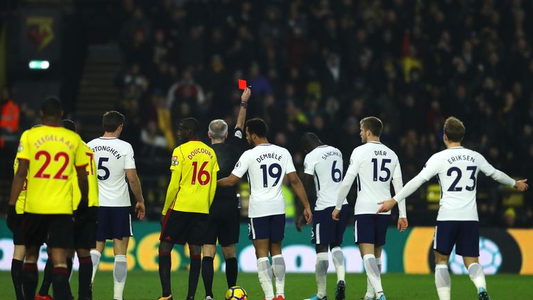 WATFORD, ENGLAND - DECEMBER 02:  Davinson Sanchez of Tottenham Hotspur is shown a red card by referee Martin Atkinson during the Premier League match betwe