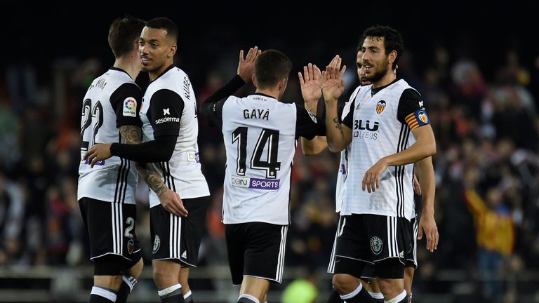Valencia's players celebrate after their late winner