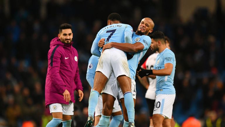 EITIHAD - NOV 29: Raheem Sterling of Manchester City celebrates victory with Vincent Kompany after the Premier Lge match against Southampton.