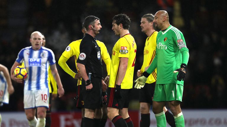 WATFORD, ENGLAND - DECEMBER 16:  Daryl Janmaat of Watford argues with the match referee Michael Oliver  during the Premier League match between Watford and