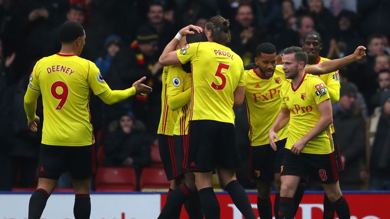 WATFORD, ENGLAND - DECEMBER 02:  Christian Kabasele of Watford celebrates after scoring his sides first goal with his Watford team mates during the Premier
