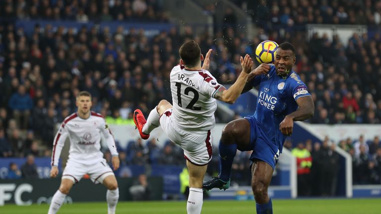LEICESTER, ENGLAND - DECEMBER 02:  Robbie Brady of Burnley and Wes Morgan of Leicester City battle for the ball during the Premier League match between Lei