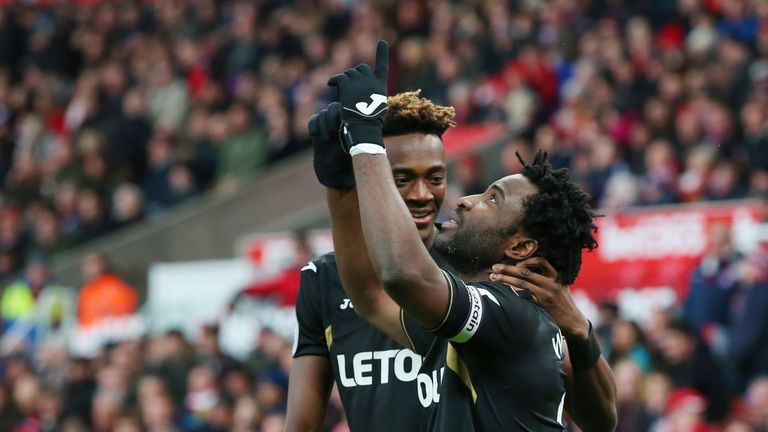 STOKE ON TRENT, ENGLAND - DECEMBER 02:  Wilfried Bony of Swansea City celebrates after scoring his sides first goal with Tammy Abraham of Swansea City duri