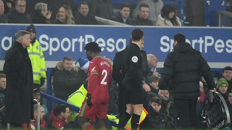 LIVERPOOL, ENGLAND - DECEMBER 18:  An injured Wilfried Bony of Swansea City (2) is substituted during the Premier League match between Everton and Swansea 