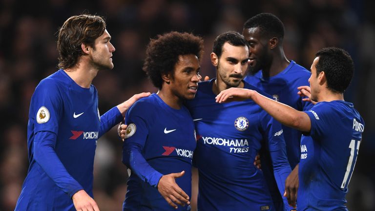 Willian (2nd L) of Chelsea celebrates scoring from the penalty spot for his team's fourth goal with Marcos Alonso (L)