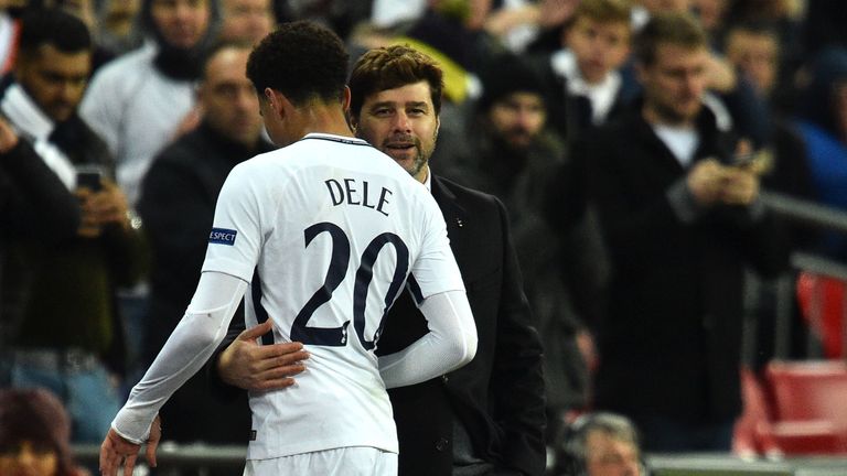 Tottenham Hotspur midfielder Dele Alli is embraced by head coach Mauricio Pochettino as he leaves the pitch in the win over Apoel in December 2017