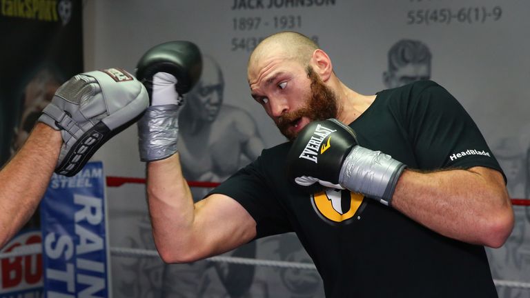 BOLTON, ENGLAND - NOVEMBER 06:  Tyson Fury in action during a training session at Team Fury Gym ahead of his fight with Dereck Chisora on November 6, 2014 