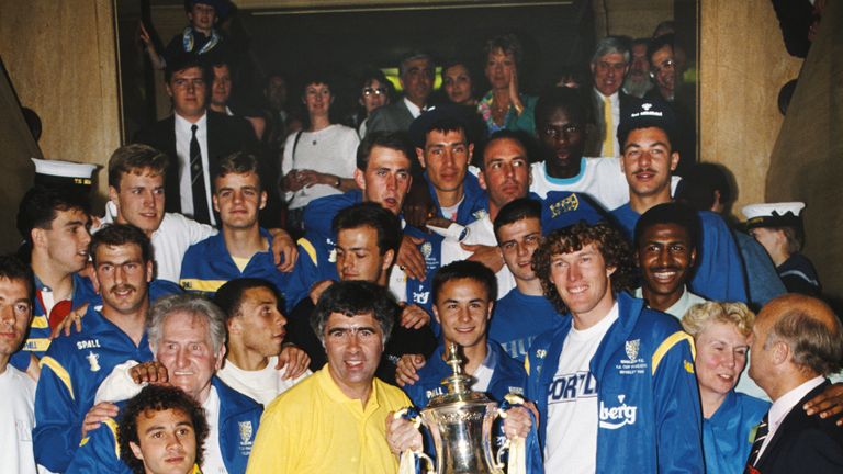 Wimbledon manager Bobby Gould and his players celebrate on the steps of the town hall following the 1988 FA Cup final win over Liverpool