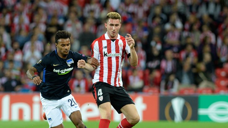 Hertha BSC Berlin's Austrian midfielder Valentino Lazaro (L) vies with Athletic Bilbao's French defender Aymeric Laporte during the Europa League football 